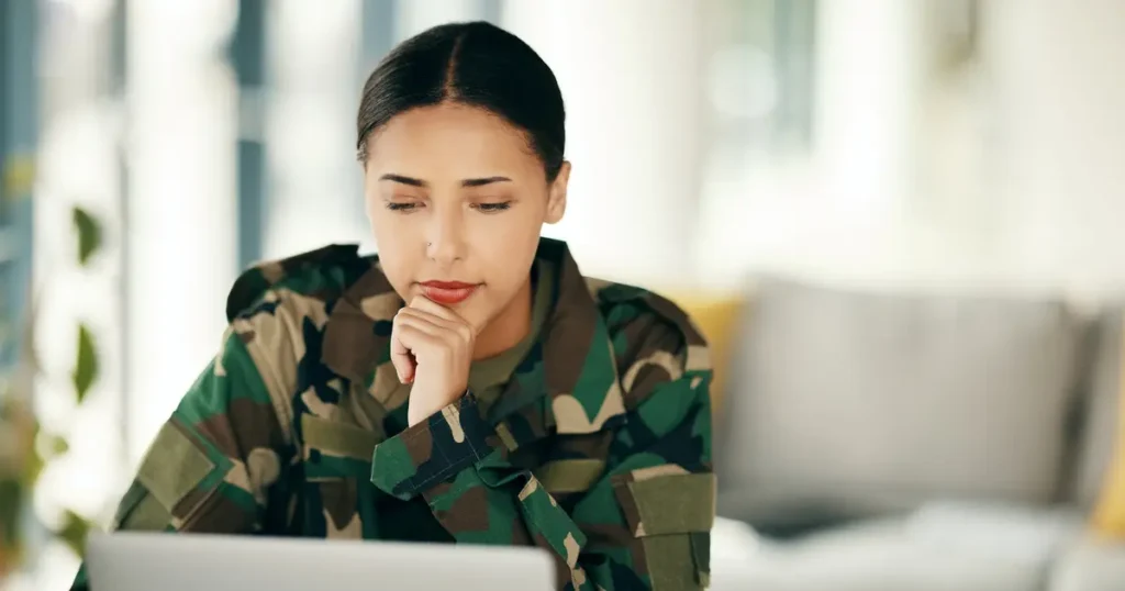 Servicemember looking at computer screen