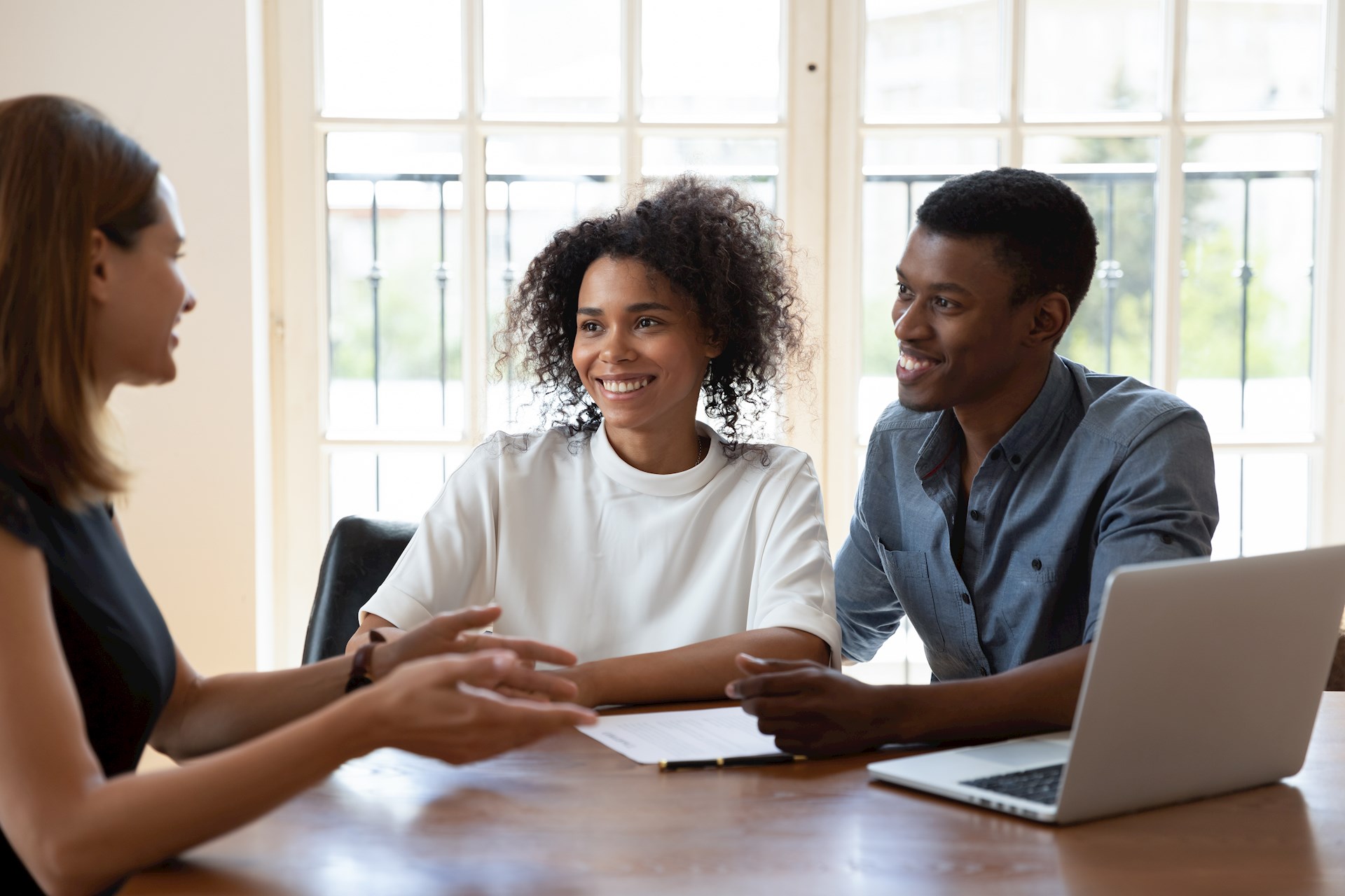 Smiling Diverse Clients Meeting Real Estate Agent At Office. (1)