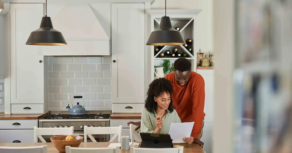 Couple reviewing financial documents.