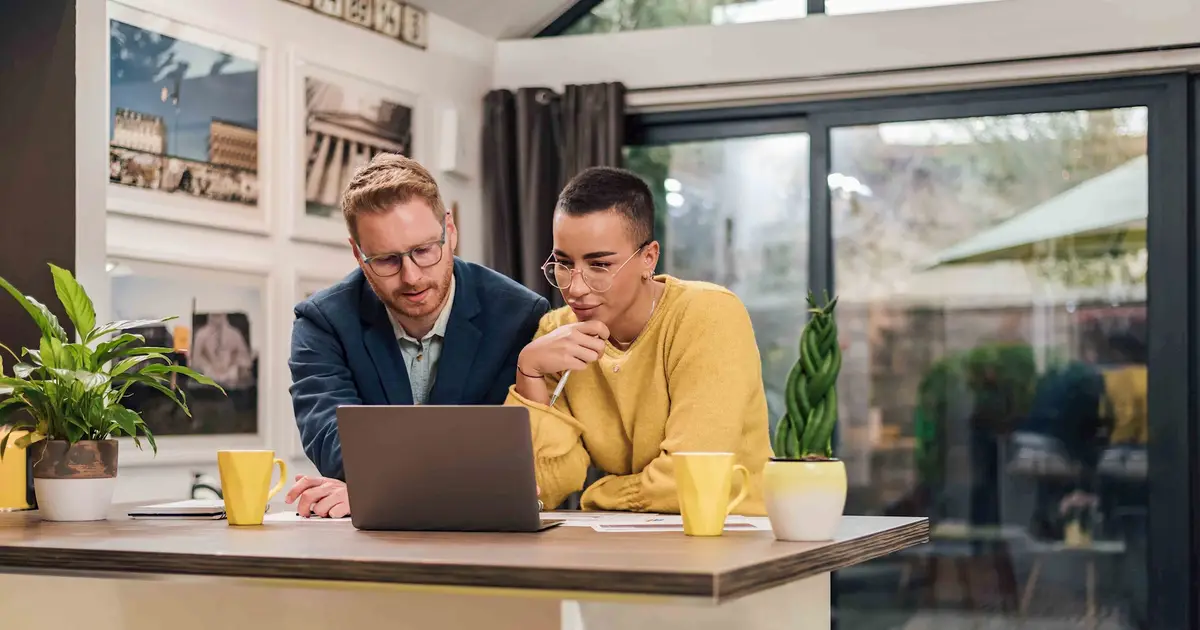 Couple looking at laptop.