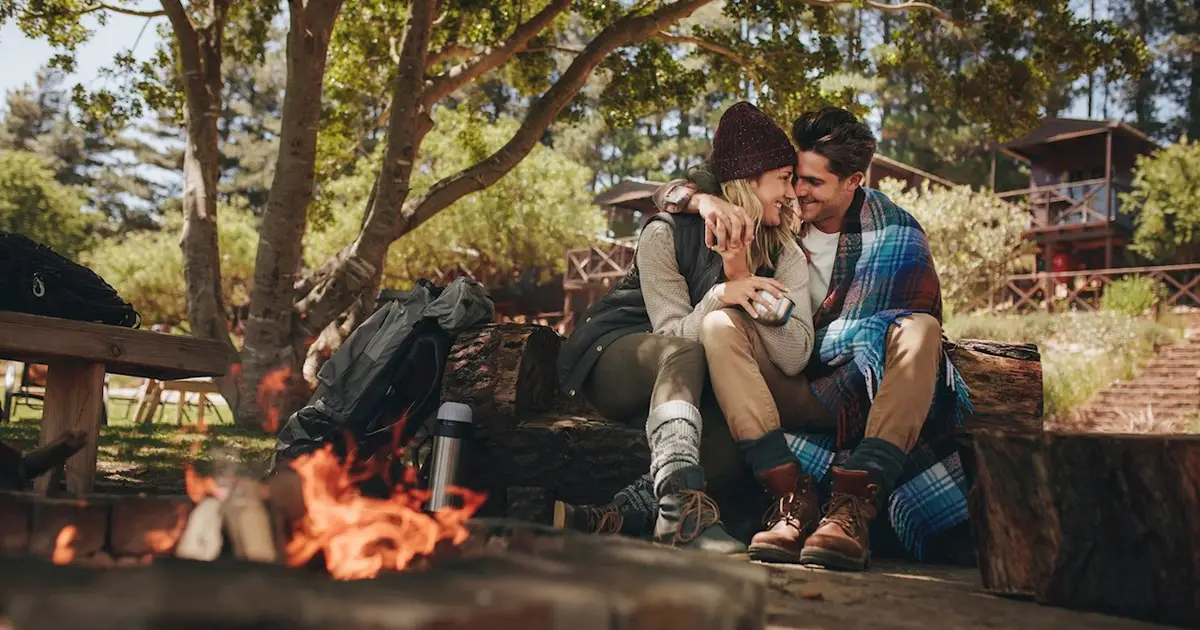 Couple enjoying a campfire.