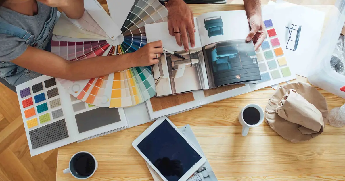 Couple reviewing home design plans.