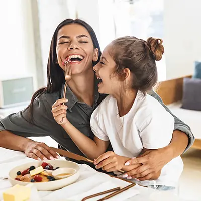 288878488 Mother and daughter eating together.