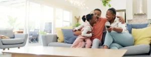 A family sitting together on a couch.
