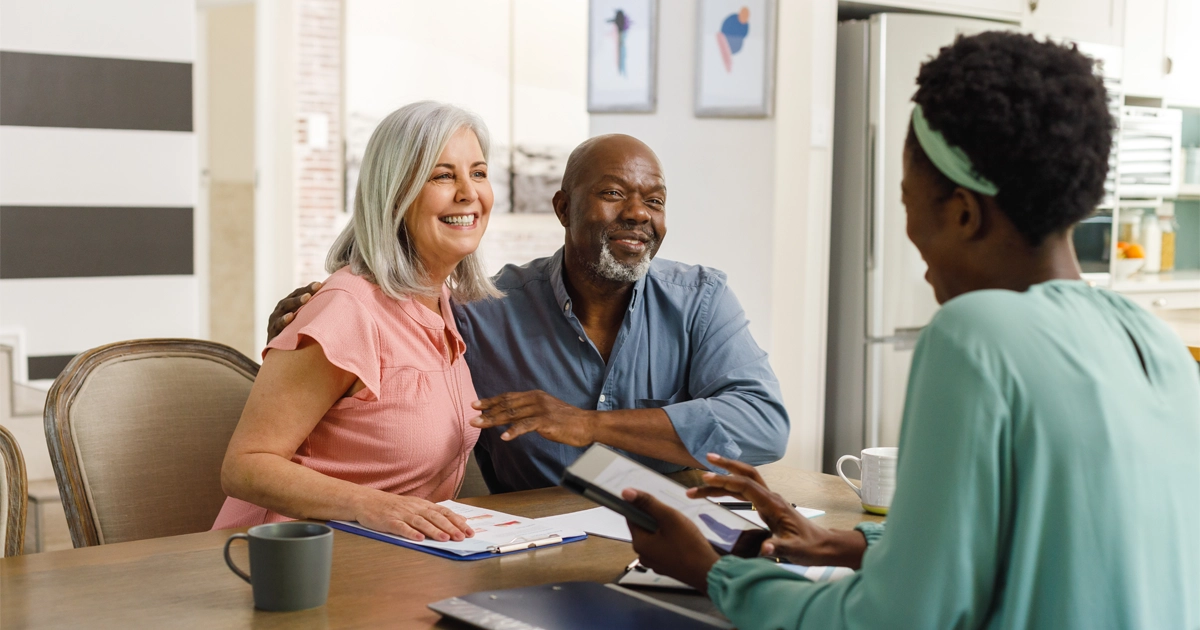 Older couple consulting with advisor.
