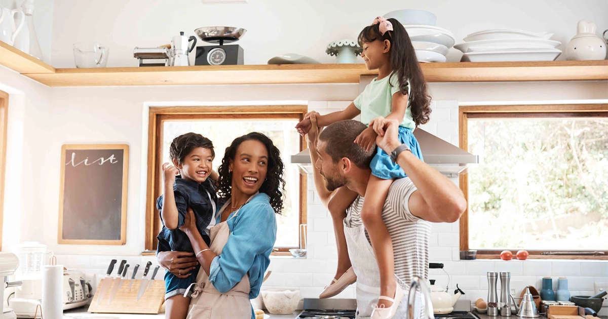 Happy family in kitchen.