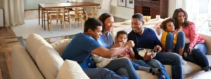 Family watching a movie at home