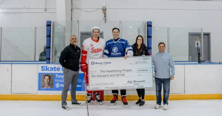 Mutual of Omaha Mortgage presents check to The Headstrong Project