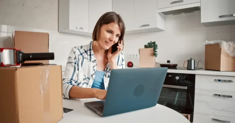 Woman using laptop at table