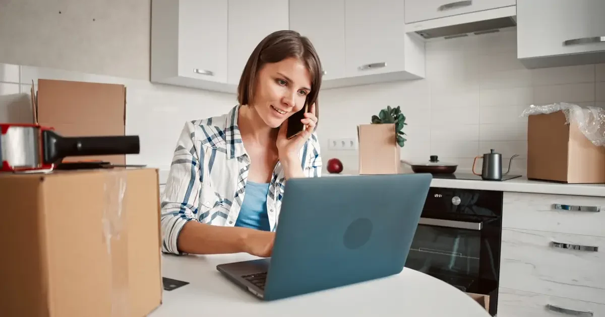 Woman using laptop at table