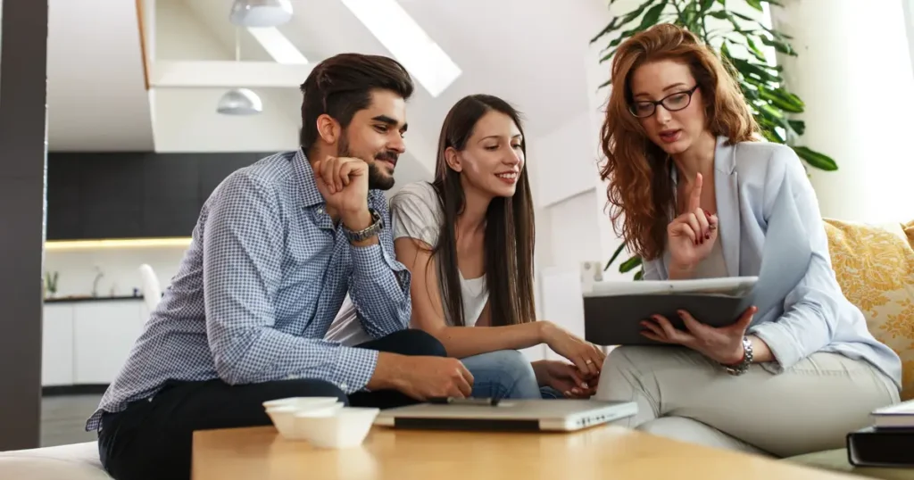 Agent meeting with happy young couple